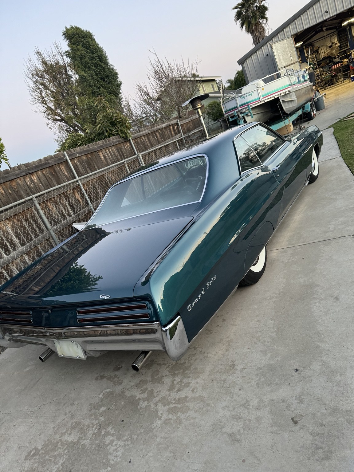 Green Pontiac Grand Prix: rear three-quarter